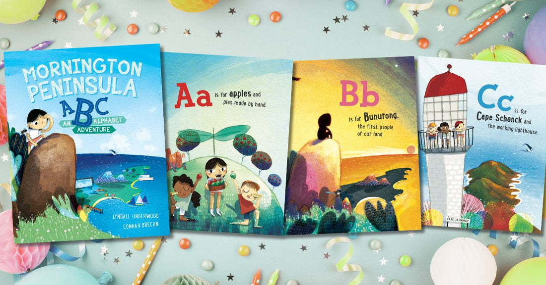 Image of the Mornington Peninsula ABC: An Alphabet Adventure book, with a three page glimpse, sitting a top birthday balloons, streamers and candles to celebrate its first book birthday